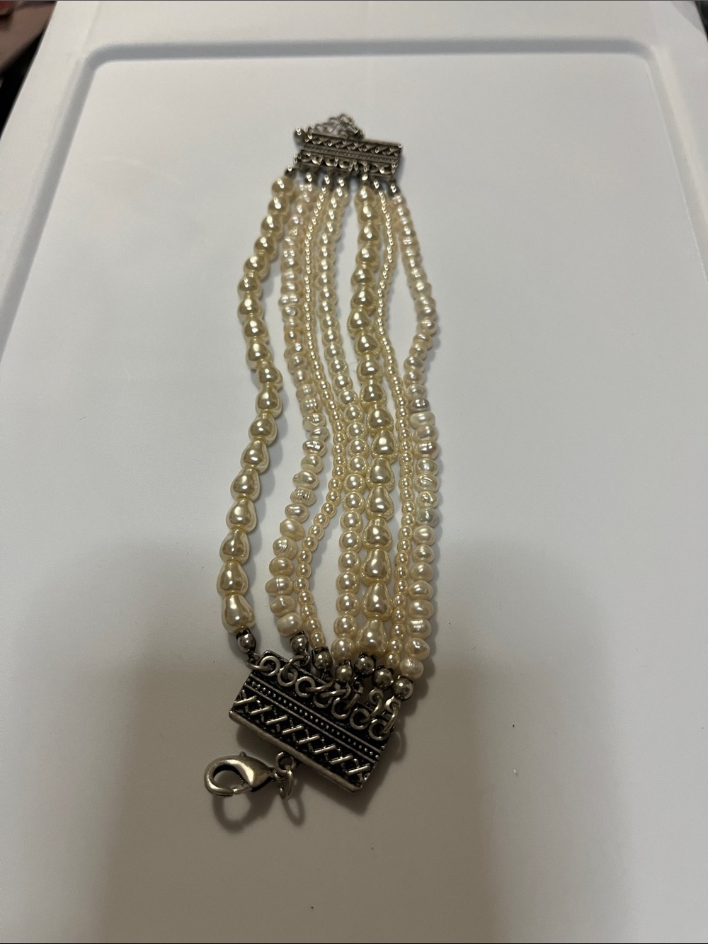 Multi-Strand Cream Pearl Bracelet with Silver-Tone Accent